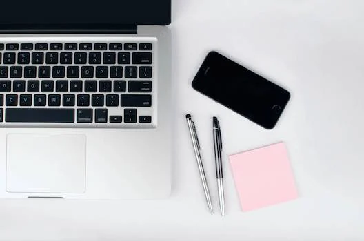 Computer and phone on table